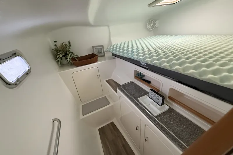 Slide: The Image of Interior cabin of 2002 Voyage 440 yacht with bed, storage, and decor. - 24
