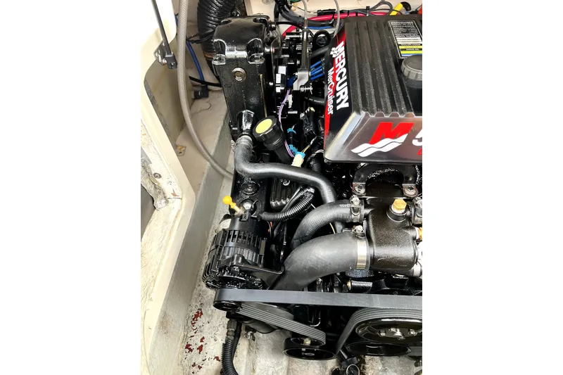 Slide: The Image of Engine compartment of a 2005 Sea Ray 240 Sundeck with Mercury MerCruiser engine. - 3
