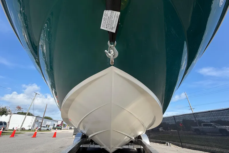 Slide: The Image of 2005 Sea Ray 240 Sundeck boat on trailer, viewed from below, with clear blue sky. - 11