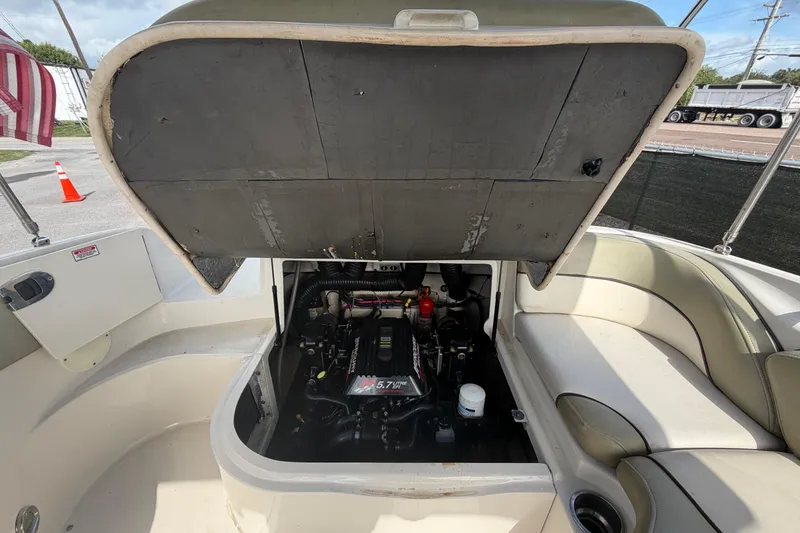 Slide: The Image of Open engine compartment of a 2005 Sea Ray 240 Sundeck boat. - 72