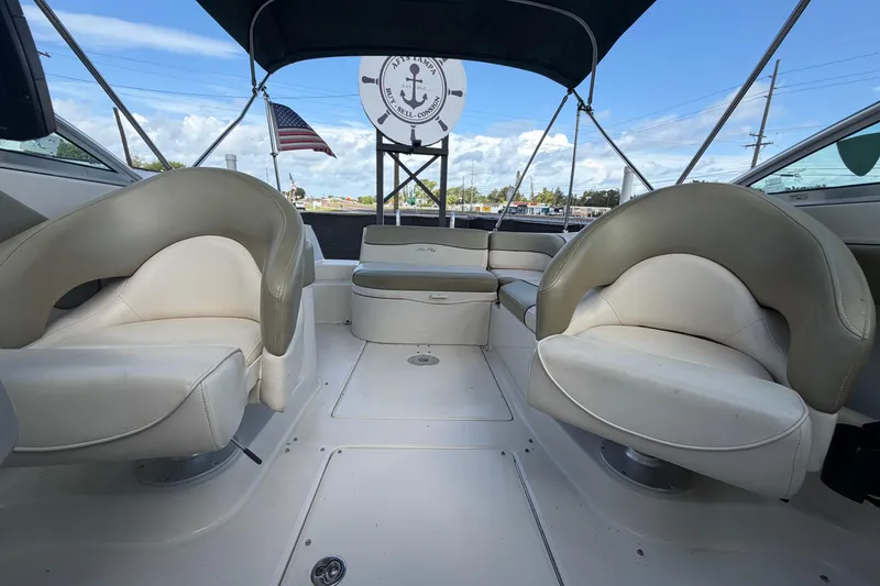 Slide: The Image of Interior view of a 2005 Sea Ray 240 Sundeck boat with seating and canopy. - 59