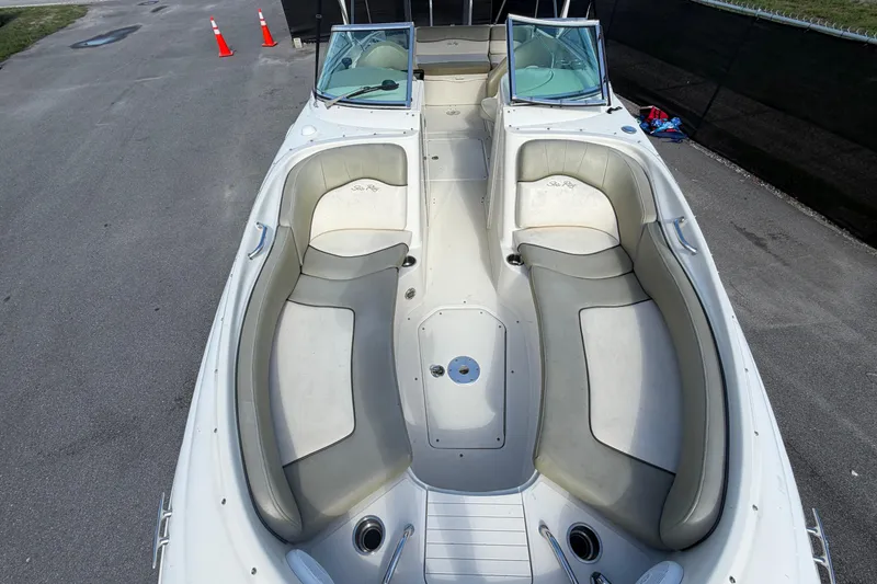 Slide: The Image of 2005 Sea Ray 240 Sundeck boat interior with spacious seating and sleek design. - 56