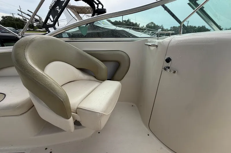 Slide: The Image of 2005 Sea Ray 240 Sundeck interior with wet seating and sleek design. - 22