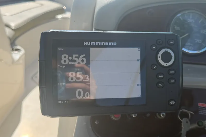 Slide: The Image of Humminbird Helix 5 display on 2005 Sea Ray 240 Sundeck, showing time and temperature. - 27
