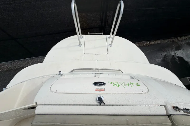 Slide: The Image of 2005 Sea Ray 240 Sundeck boat with swim platform and ladder, viewed from above. - 25