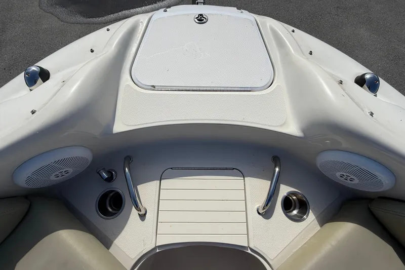 Slide: The Image of The image shows the bow of a 2005 Sea Ray 240 Sundeck boat with speakers and grab handles. - 50