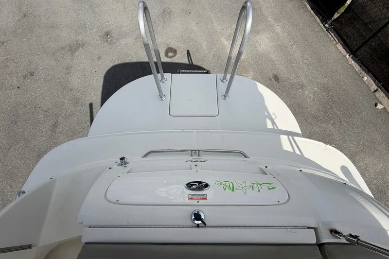 Slide: The Image of 2005 Sea Ray 240 Sundeck boat with swim platform and ladder, viewed from above. - 77