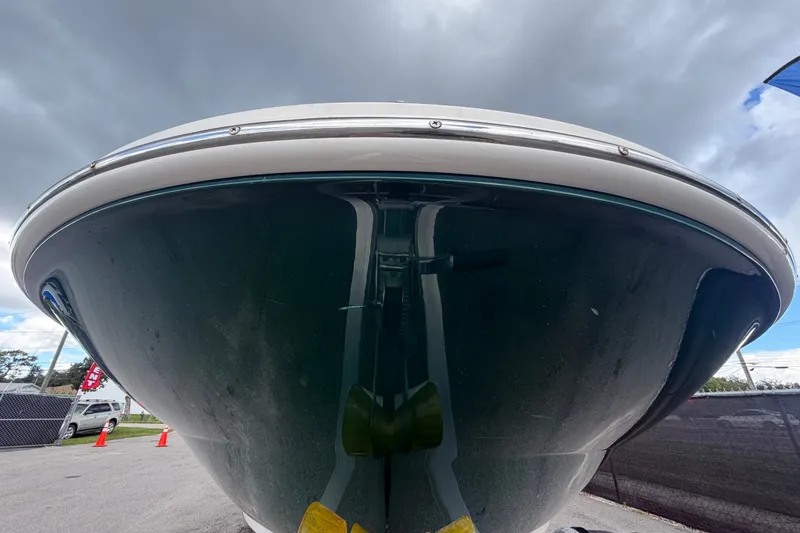 Slide: The Image of 2005 Sea Ray 240 Sundeck boat, front view under cloudy sky. - 10