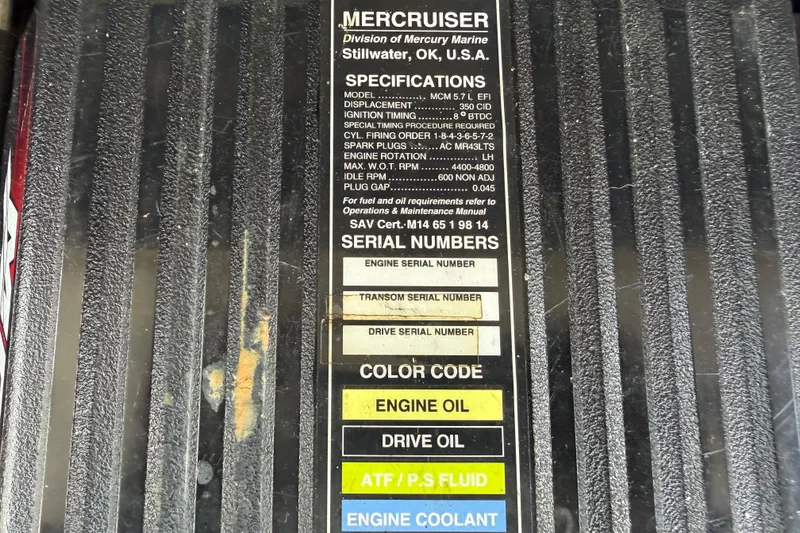 Slide: The Image of Label on MerCruiser engine cover detailing specifications and serial numbers for a 2005 Sea Ray 240 Sundeck. - 75