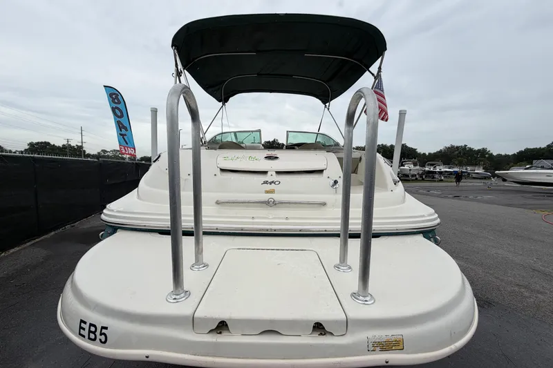 Slide: The Image of 2005 Sea Ray 240 Sundeck boat with swim platform and canopy, displayed for sale. - 3
