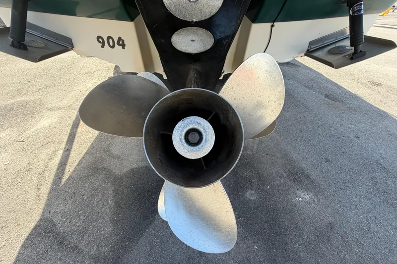 Slide: The Image of Propeller of a 2005 Sea Ray 240 Sundeck boat on pavement. - 4