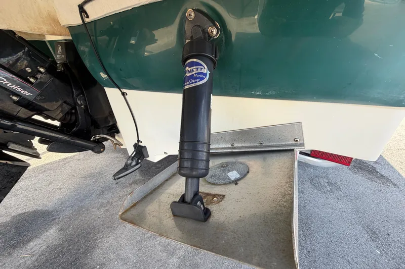 Slide: The Image of 2005 Sea Ray 240 Sundeck boat with trim tab and outdrive detail. - 5