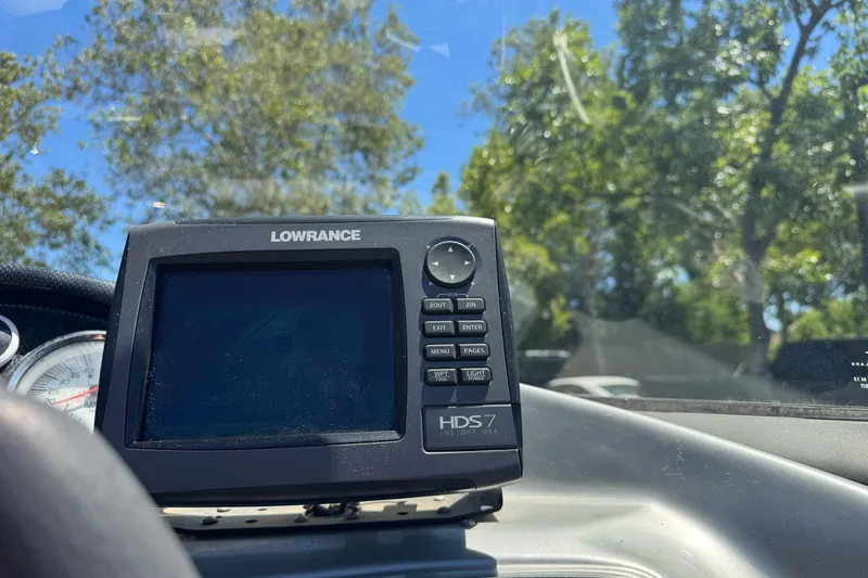 Slide: The Image of Lowrance HDS-7 fishfinder on 2012 Tracker Targa V-18 Combo boat dashboard, sunny day. - 18