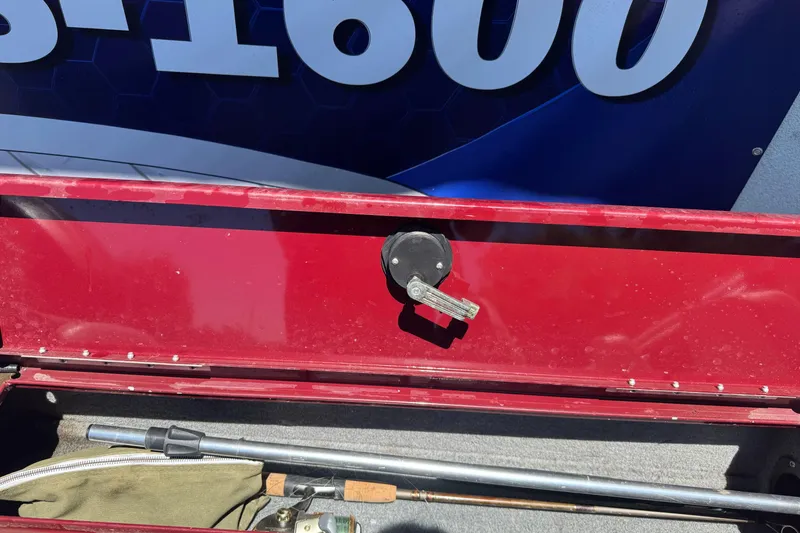 Slide: The Image of Red storage compartment on a 2012 Tracker Targa V-18 Combo boat. - 25
