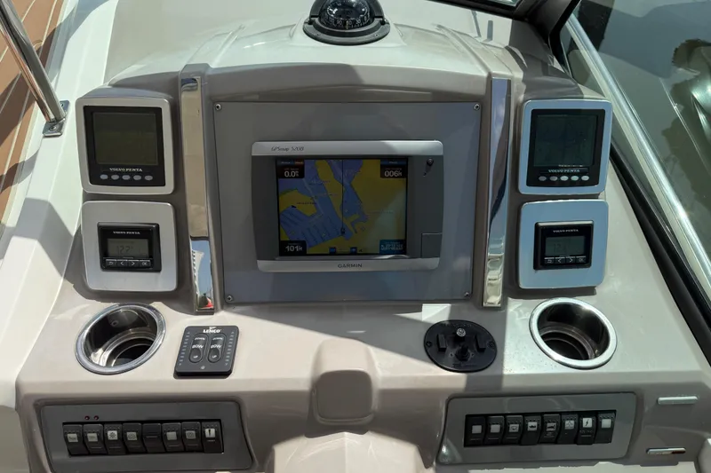 Slide: The Image of Dashboard of 2011 Chaparral 310 Signature boat with navigation and control systems. - 28