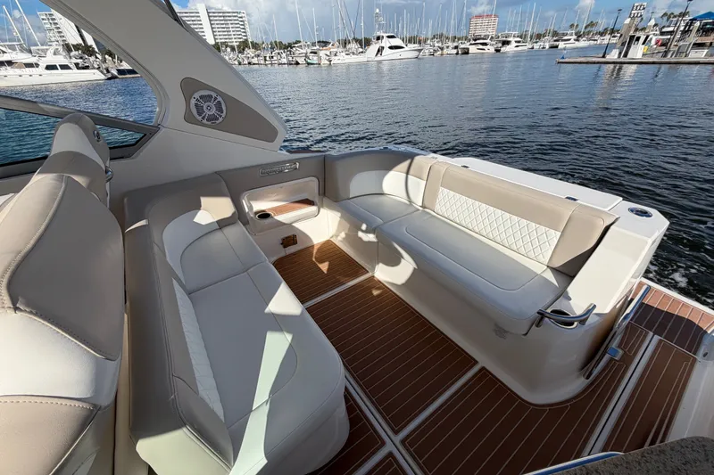 Slide: The Image of Luxurious 2011 Chaparral 310 Signature boat interior with elegant seating and waterfront view. - 13