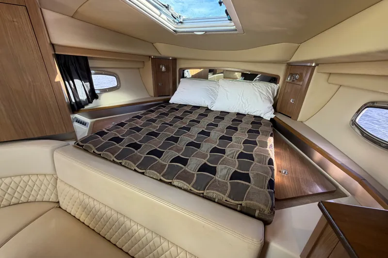 Slide: The Image of Luxurious interior cabin of 2011 Chaparral 310 Signature yacht with cozy bed and elegant design. - 20
