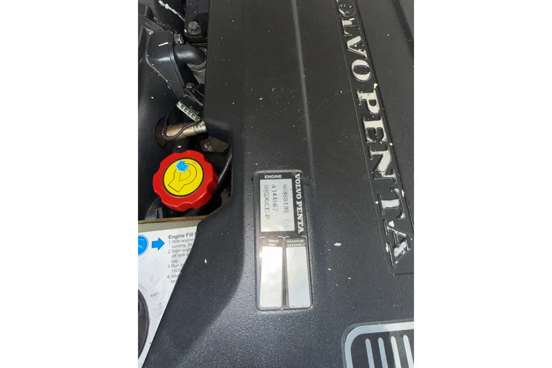 Slide: The Image of Volvo Penta engine in 2011 Chaparral 310 Signature boat, featuring red oil cap. - 58