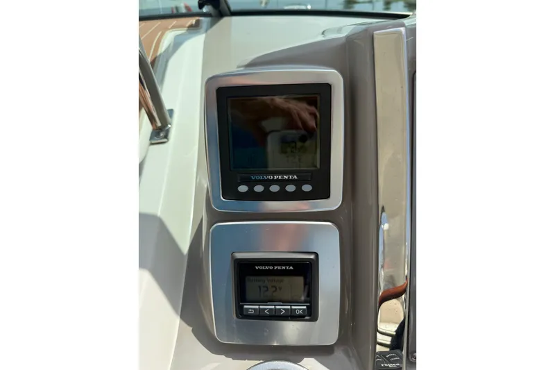 Slide: The Image of Volvo Penta control panel on 2011 Chaparral 310 Signature boat dashboard. - 31
