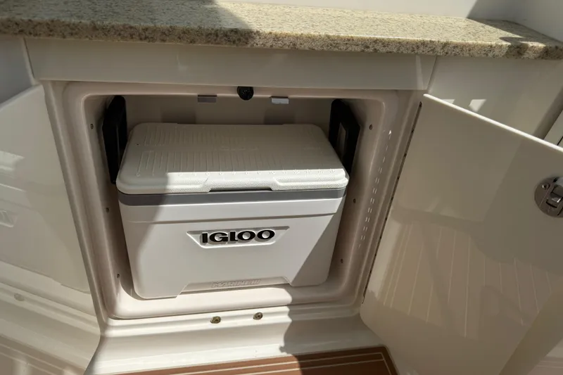 Slide: The Image of Igloo cooler stored in Chaparral 310 Signature boat compartment, 2011 model. - 23