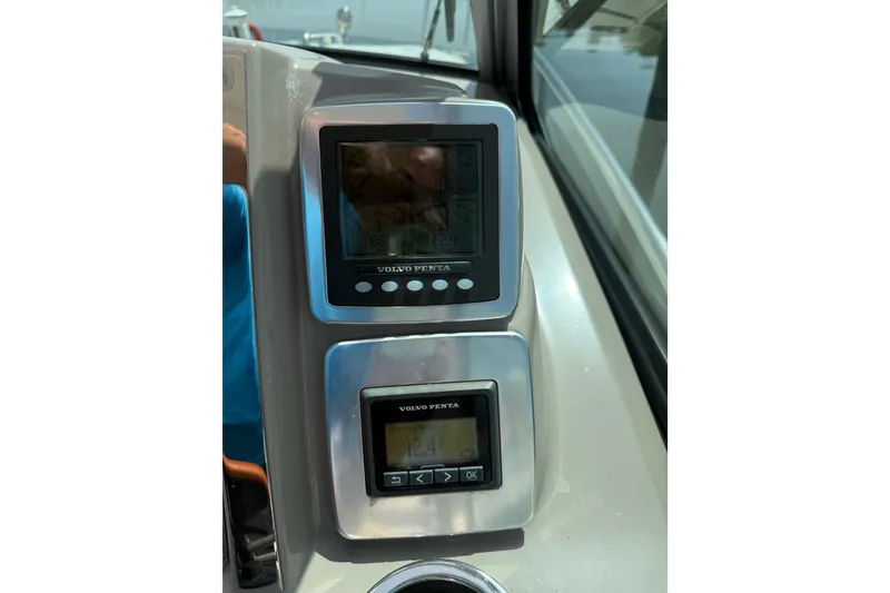 Slide: The Image of Volvo Penta control panel on 2011 Chaparral 310 Signature boat dashboard. - 30