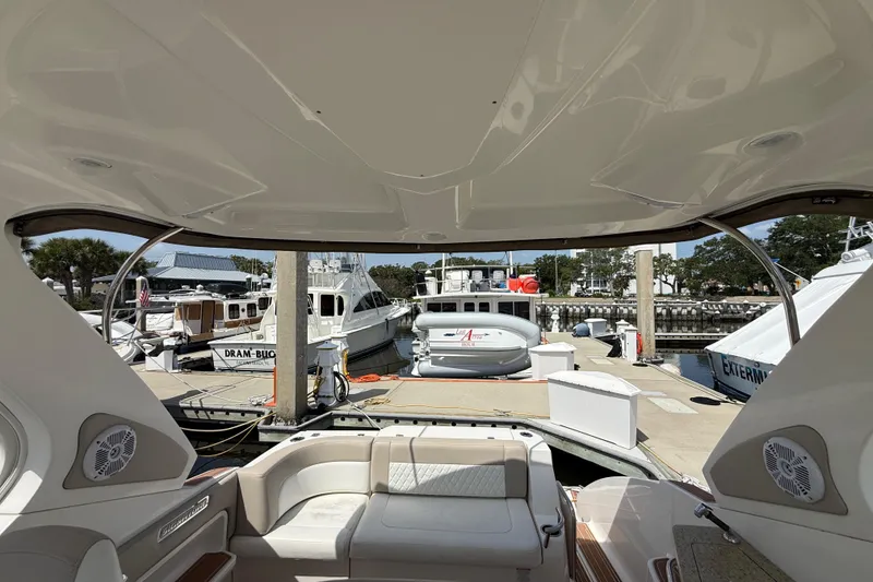 Slide: The Image of Interior view of a 2011 Chaparral 310 Signature yacht docked at a marina. - 15
