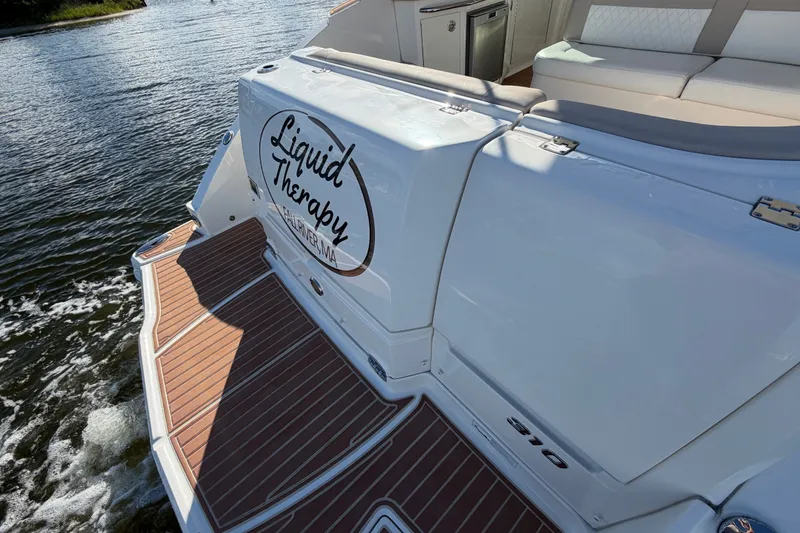 Slide: The Image of 2011 Chaparral 310 Signature boat with "Liquid Therapy" decal on water. - 16