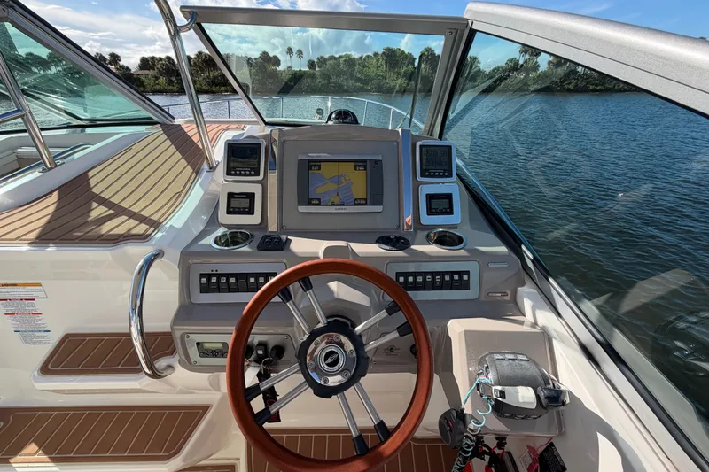 Slide: The Image of Cockpit view of 2011 Chaparral 310 Signature boat with navigation system. - 10