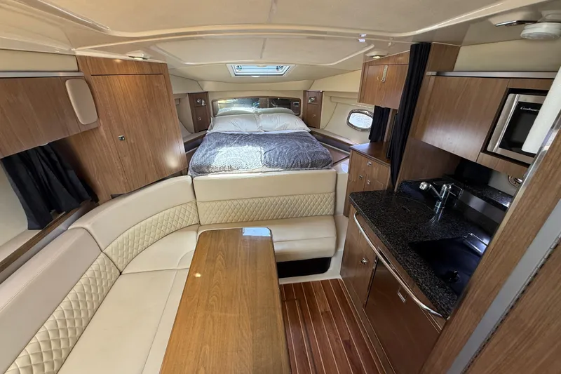 Slide: The Image of Luxurious interior of 2011 Chaparral 310 Signature boat with cozy seating and modern amenities. - 35