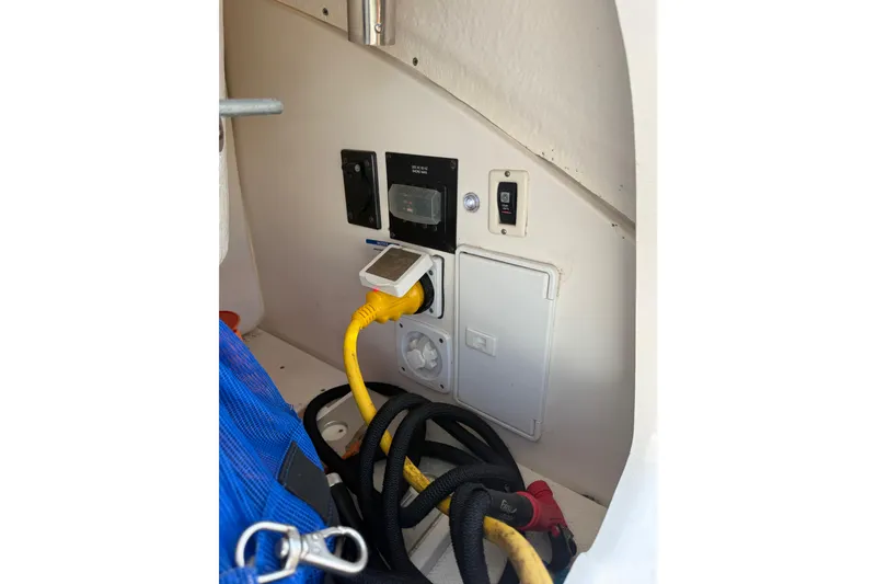Slide: The Image of Electrical panel and cables in a 2011 Chaparral 310 Signature boat. - 47