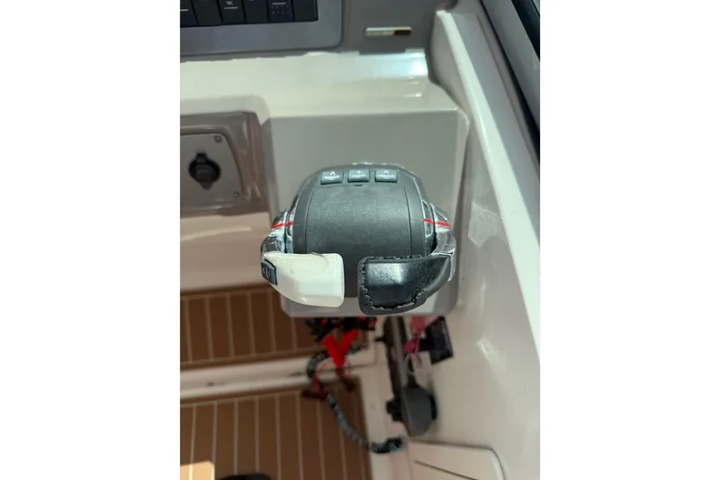 Slide: The Image of Throttle control of a 2011 Chaparral 310 Signature boat, showcasing cockpit details. - 32
