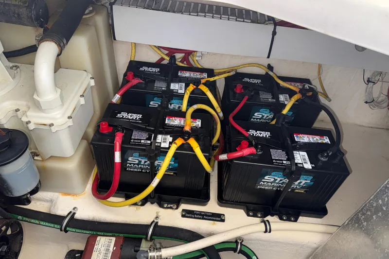 Slide: The Image of Batteries in a 2011 Chaparral 310 Signature boat engine compartment. - 53
