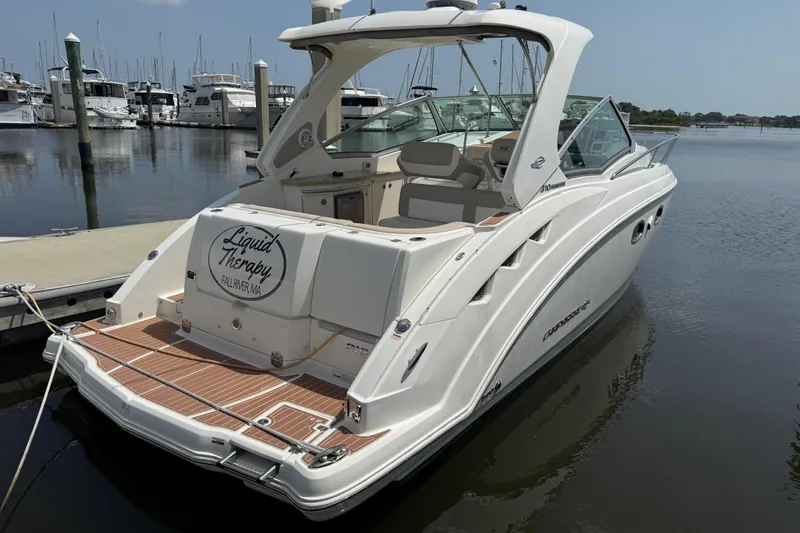Slide: The Image of 2011 Chaparral 310 Signature boat docked at marina, rear view. - 6
