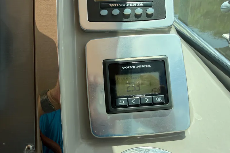 Slide: The Image of Volvo Penta control panel on 2011 Chaparral 310 Signature boat dashboard. - 57