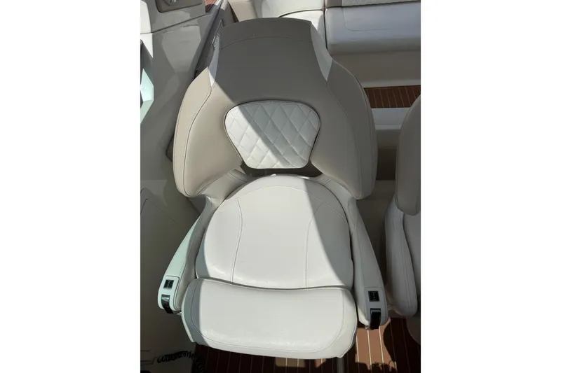 Slide: The Image of Luxurious white leather seat in 2011 Chaparral 310 Signature boat. - 24
