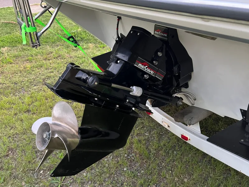 Slide: The Image of A 1995 Checkmate Persuader 234 with a Mercury drive and stainless steel propeller. - 2