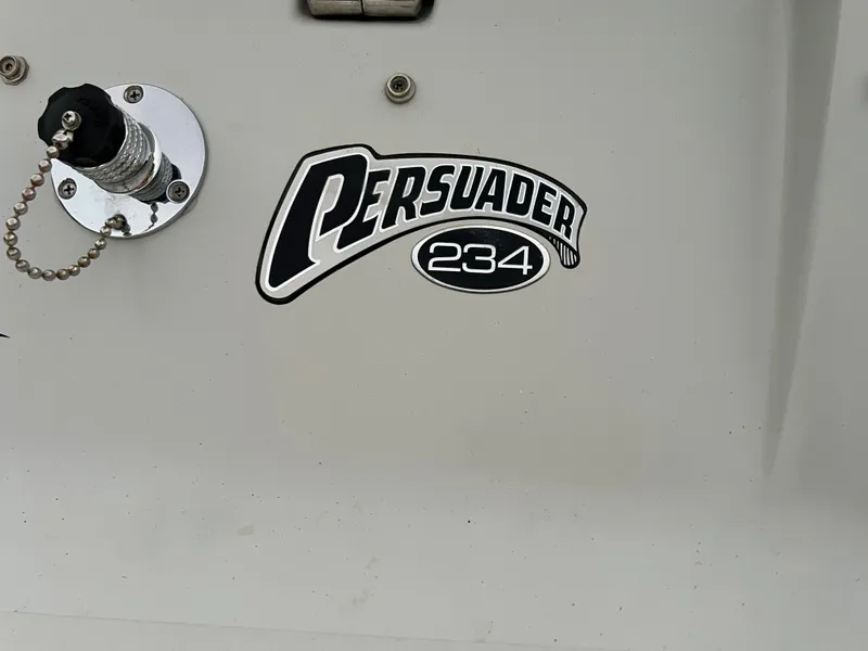 Slide: The Image of Close-up of the "Persuader 234" logo on a boat hull. - 3