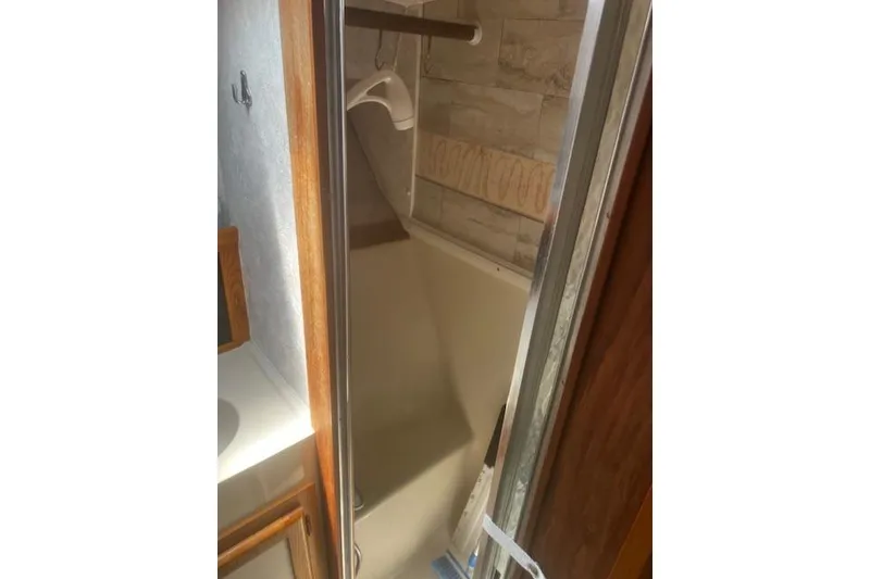Slide: The Image of Interior view of 1987 Silverton 34 Convertible boat shower area. - 38