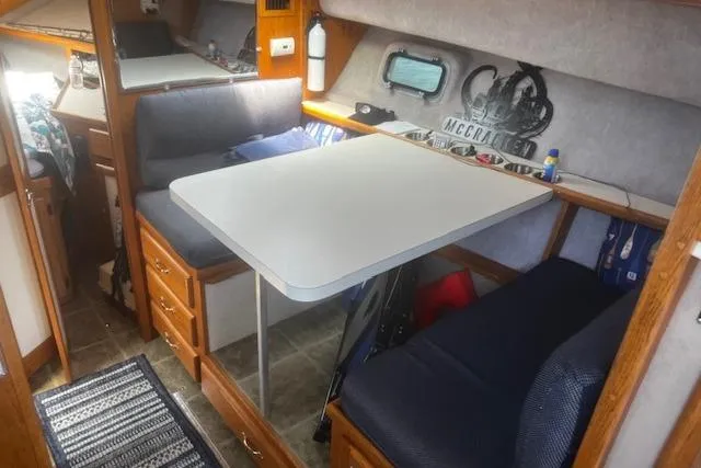 Slide: The Image of Interior of 1987 Silverton 34 Convertible boat with dining area and seating. - 29