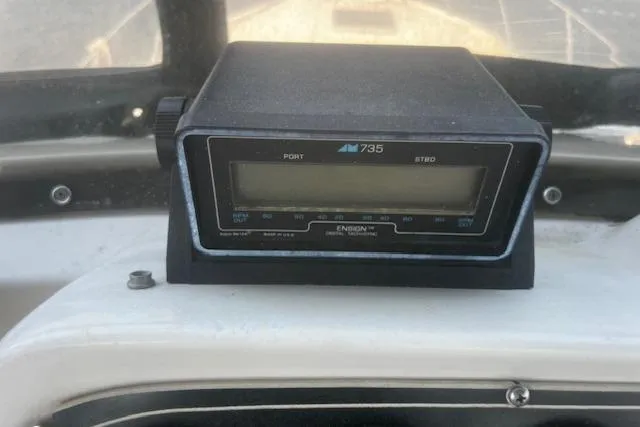 Slide: The Image of 1987 Silverton 34 Convertible boat dashboard with Ensign 735 marine instrument. - 10