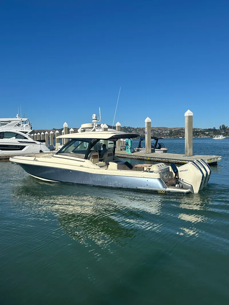 The Image of 2023 Chris-Craft Calypso 35 docked on calm water. - 0