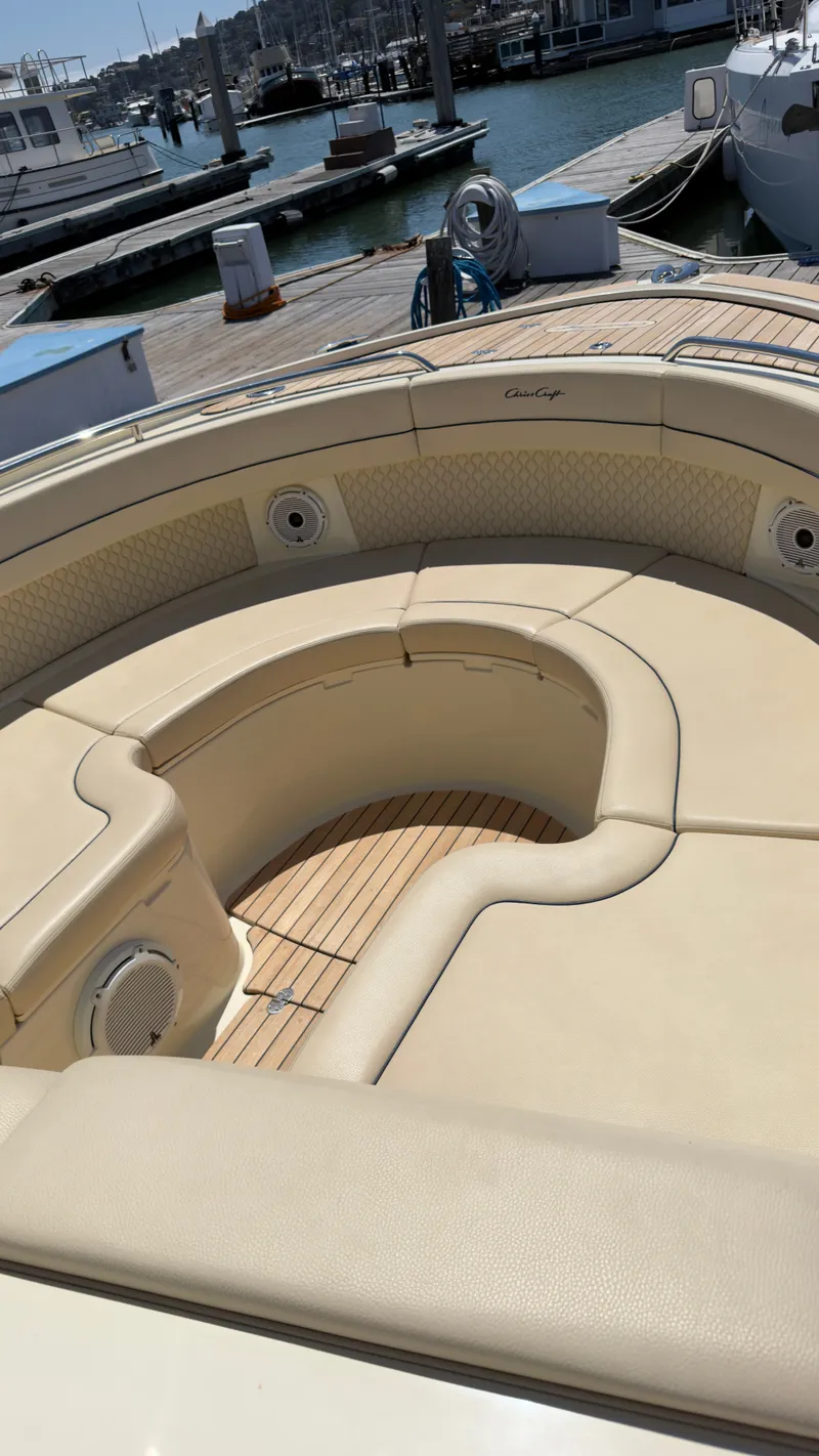 Slide: The Image of The image shows the cockpit of a Chris-Craft Calypso 35 with beige upholstery and wooden flooring. - 7