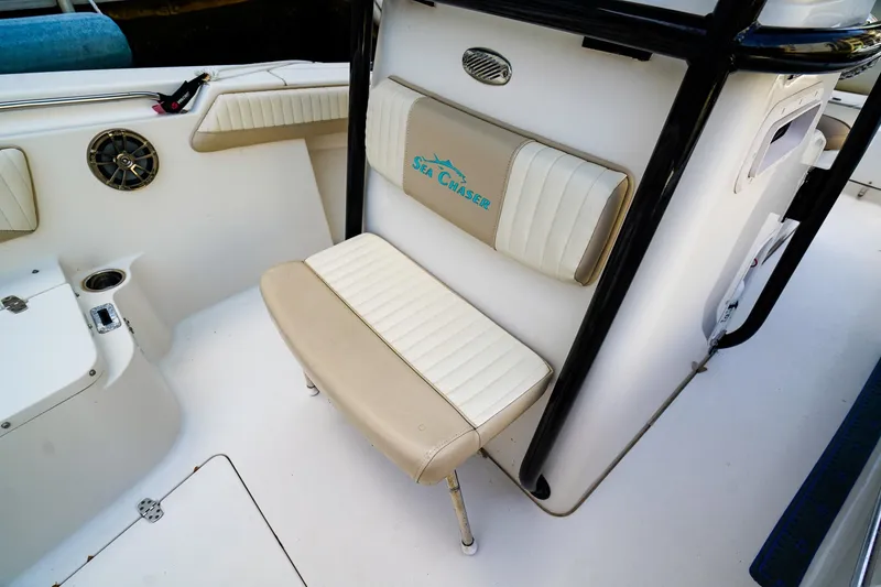 Slide: The Image of 2018 Sea Chaser 24 HFC boat interior with cushioned seating and speaker. - 19