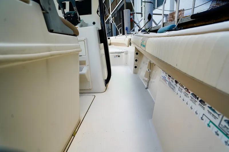Slide: The Image of 2018 Sea Chaser 24 HFC boat interior, showcasing spacious deck and seating area. - 8