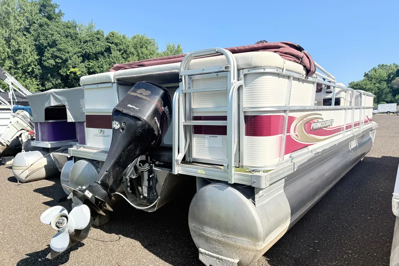 Slide: The Image of 2002 Princecraft Vantage 24 L pontoon boat with outboard motor, parked on asphalt. - 13