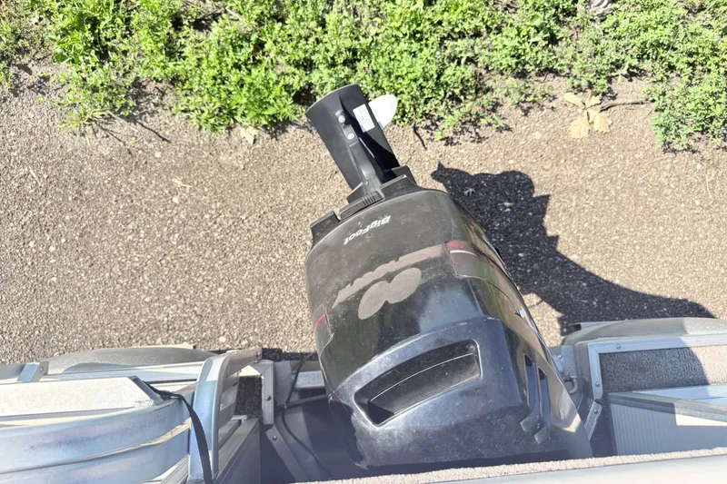 Slide: The Image of Overhead view of a 2002 Princecraft Vantage 24 L boat motor on a gravel surface. - 11
