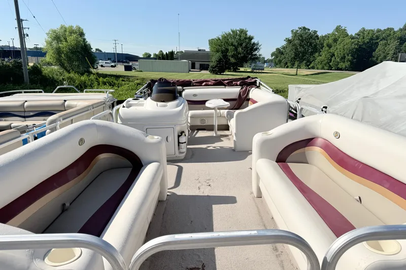 Slide: The Image of 2002 Princecraft Vantage 24 L pontoon boat with spacious seating and outdoor setting. - 2