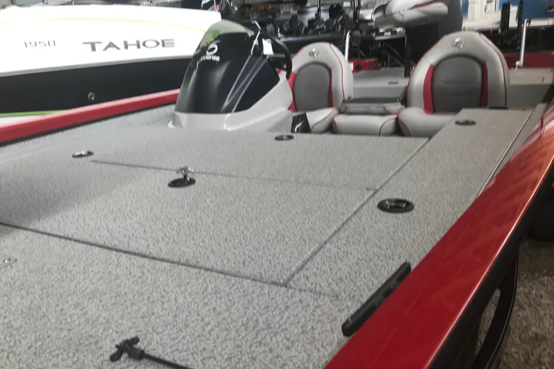 Slide: The Image of 2018 G3 Sportsman 19 boat with red accents and comfortable seating. - 14