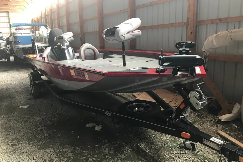 The Image of 2018 G3 Sportsman 19 boat in storage, featuring a sleek design and modern equipment. - 2