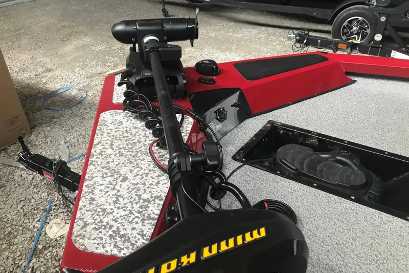 Slide: The Image of 2018 G3 Sportsman 19 boat with trolling motor and pedal controls on deck. - 13